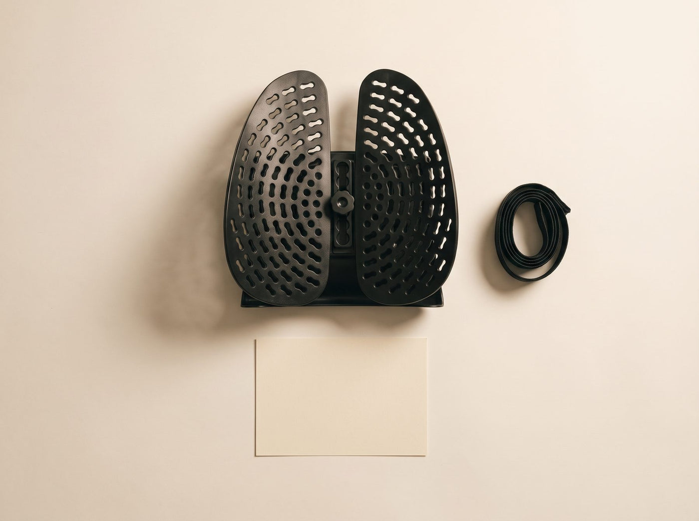 The Uprite lumbar support and its strap laid flat