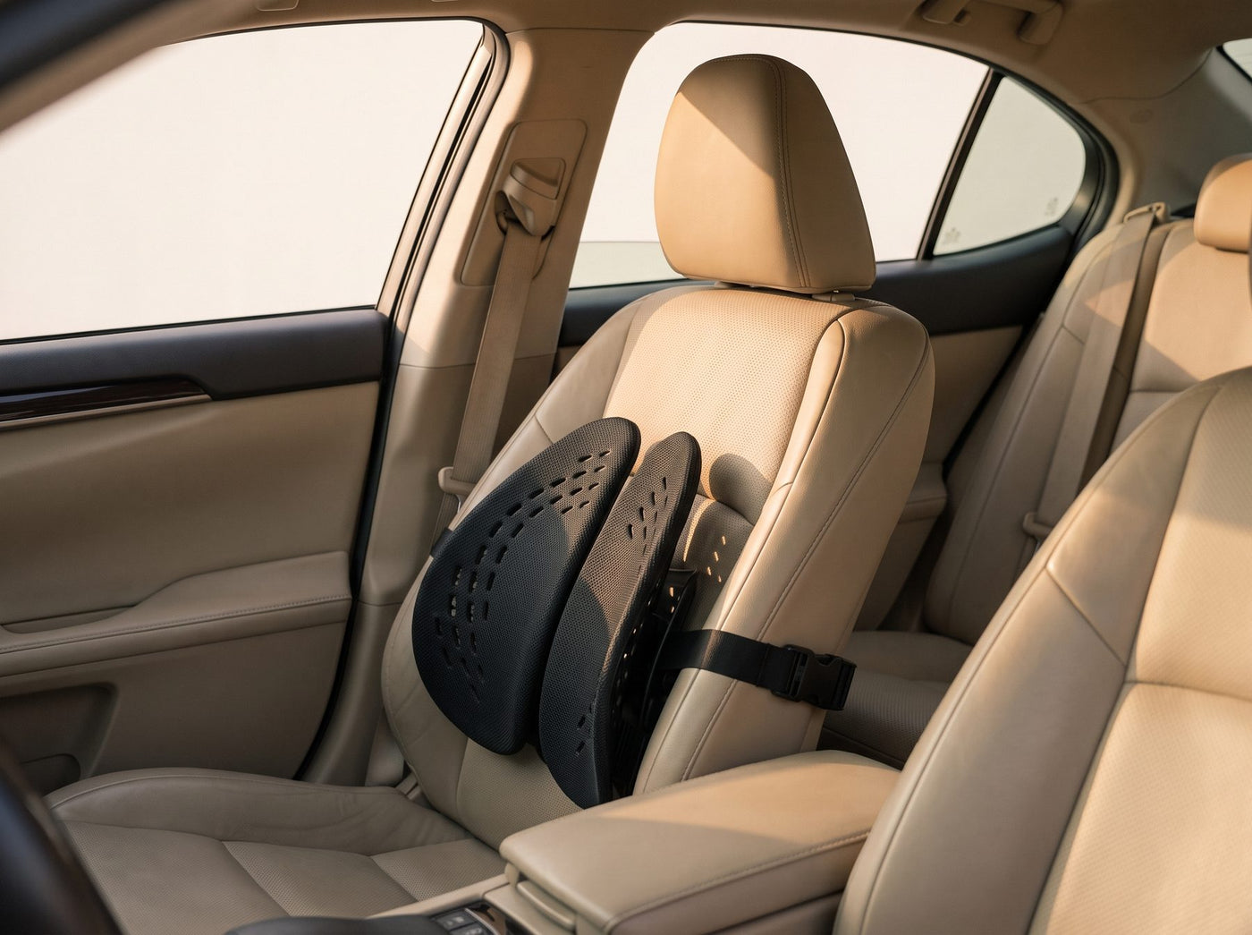 The Uprite lumbar support strapped to a car seat